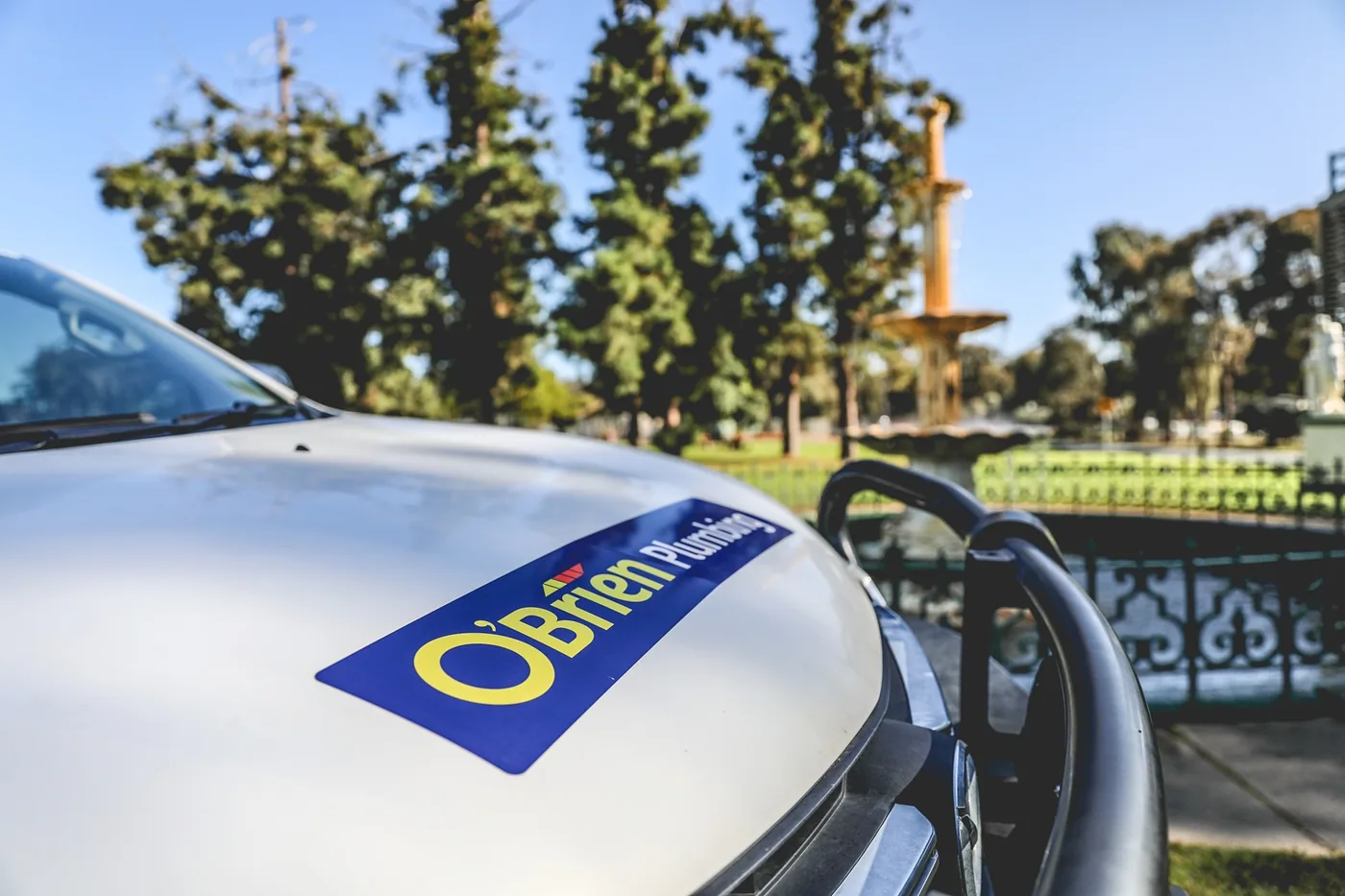 O'Brien Plumbing logo on the bonnet of a work ute